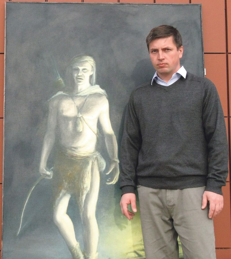 Malíř Martin Kuriš před svým obrazem