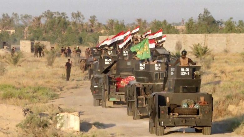 Irácké jednotky při nástupu k ofenzívě u Fallúdži 