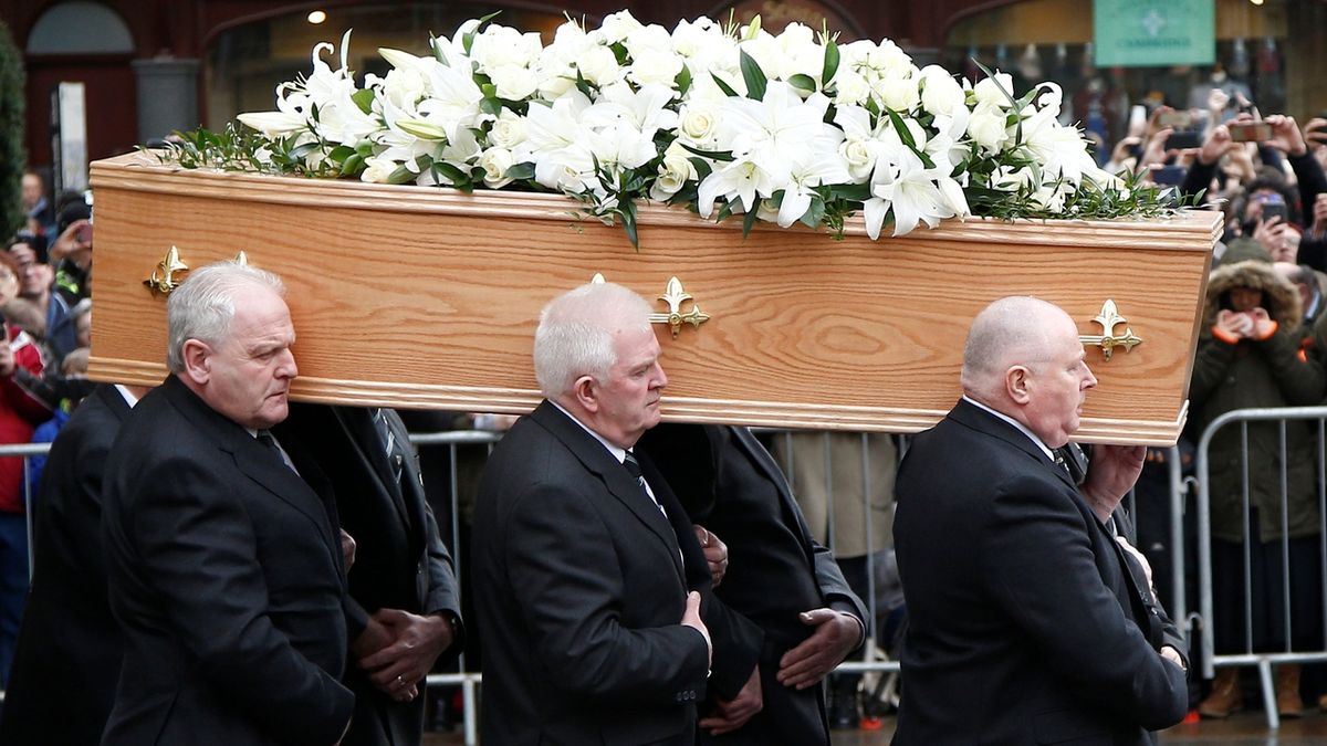 Pallbearers carry the coffin out of Great St Marys Church at the end of the funeral of theoretical physicist Prof Stephen Hawking.
