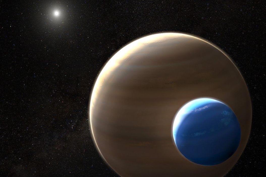 Vizualizace planety a potenciálního měsíce ve hvězdném systému Kepler-1625b