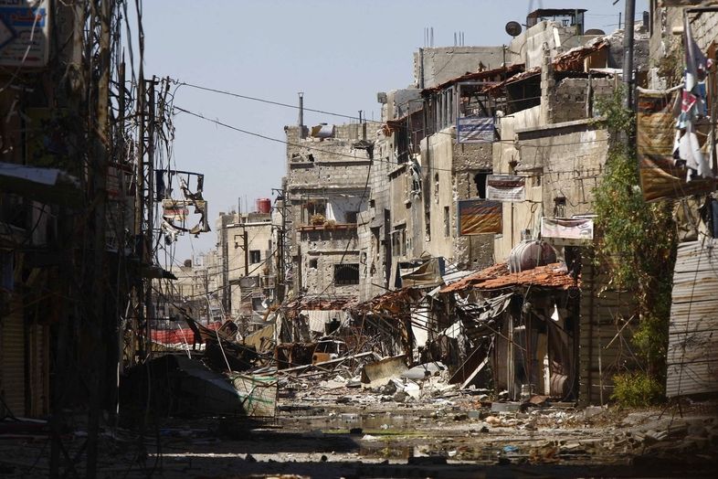 Boji poničené čtvrt Damašku u šíitské mešity Sajída Zajnab