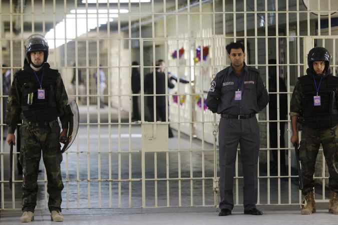 Dozorci ve věznici Abú Ghrajb