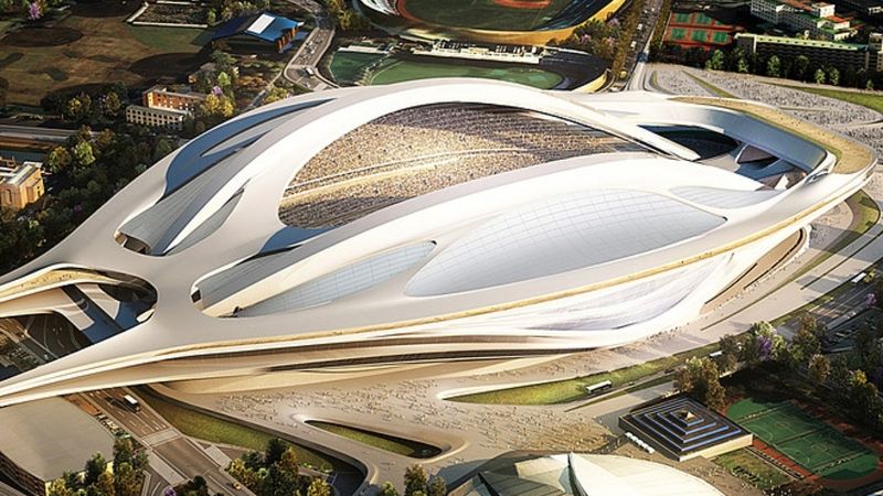 Pod návrh 70 metrů vysoké futuristické konstrukce připomínající obří cyklistickou helmu či kosmickou loď se podepsala britsko-irácká architektka Zaha Hadidová.
