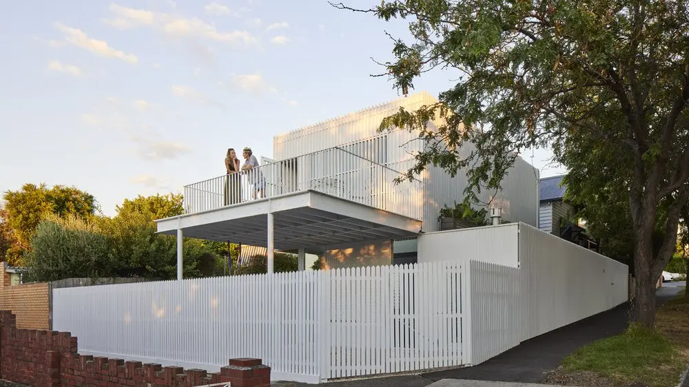 Architects add fun extension to historic home with lots of battens and rods