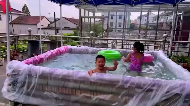 The father built a simple but nice swimming pool for the children