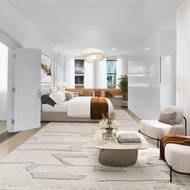 Hlavní ložnice penthousu má i svůj vlastní prostor s posezením