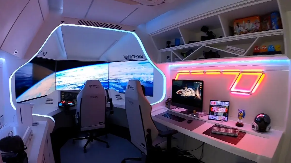 A computer game lover decorates his room as a shuttle cockpit