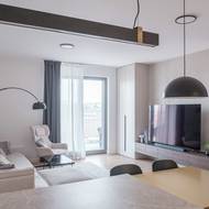 Pohled na obývací část zpoza pracovní desky v kuchyni