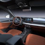 Infotainment má úhlopříčku 10" a nechybí ani fyzické ovladače ventilace.