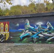 Street art na jediné zdi v pražském Braníku v průběhu let — Caer8th a David Reichelt