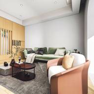 Společenskou část obývacího pokoje vymezuje koberec.