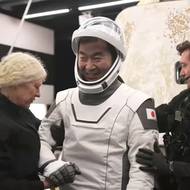 Japonský člen posádky Kimija Jui a jeho úsměv po návratu na domovskou planetu