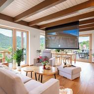 Namísto klasické televize je v obývacím pokoji stahovací promítací plátno. Jeho výhoda je zřejmá - zabírá méně místa a nevyžaduje si pro sebe volnou stěnu.